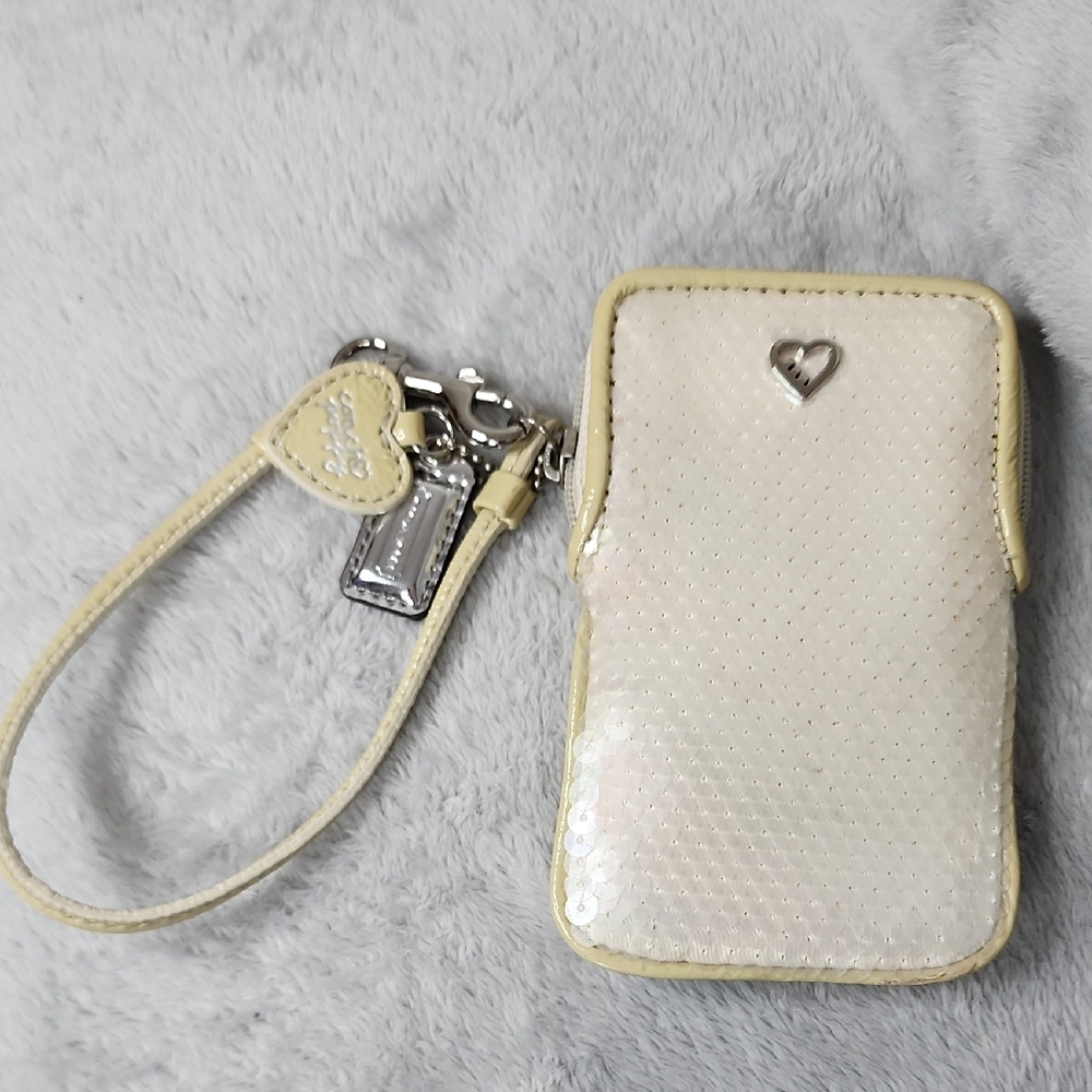Coach Poppy vintage cream iridescent sequin small wristlet.